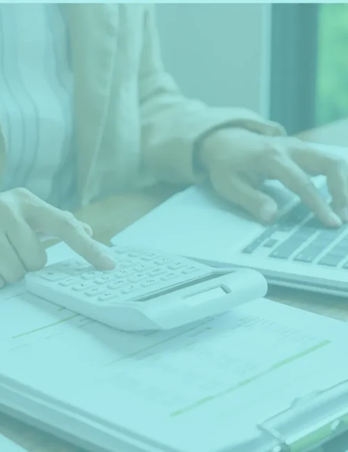 Bookkeeping clean-up services represented by woman working with a laptop and calculator